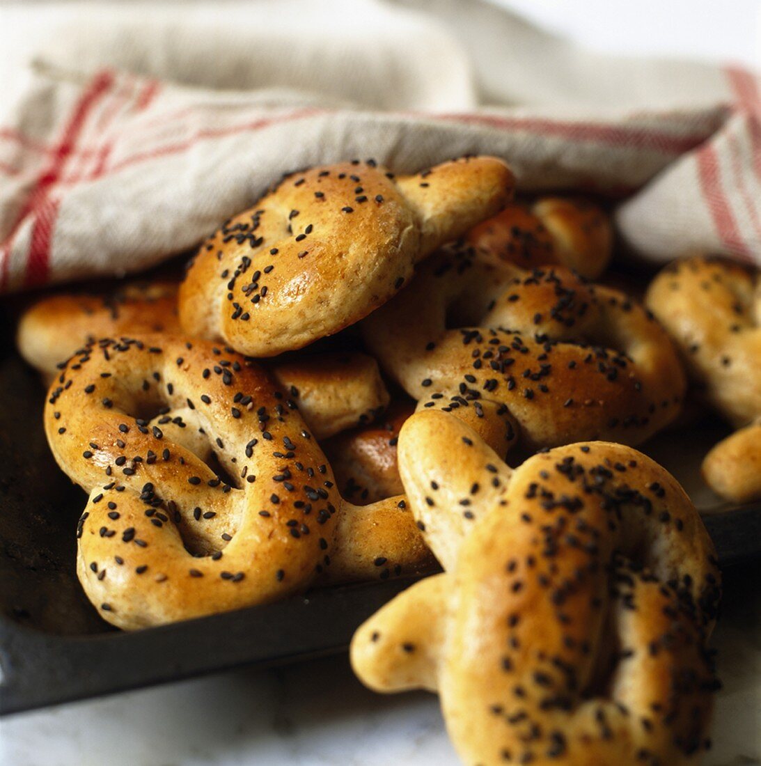 Freshly-baked pretzels with black sesame seeds