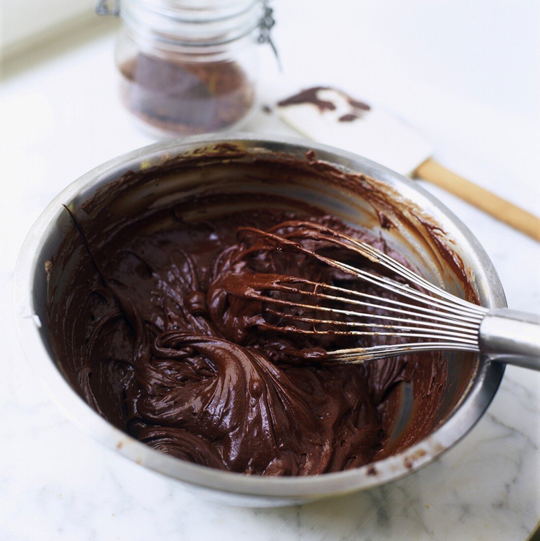 Chocolate cream with whisk in a bowl