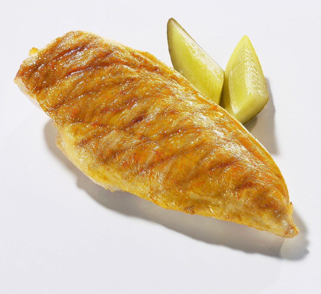 Grilled chicken breast fillet with gherkins