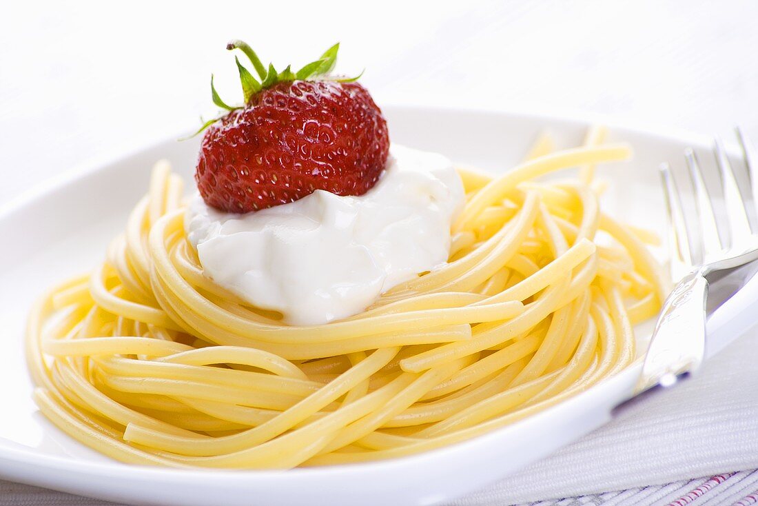 Spaghetti with soft cheese and strawberry