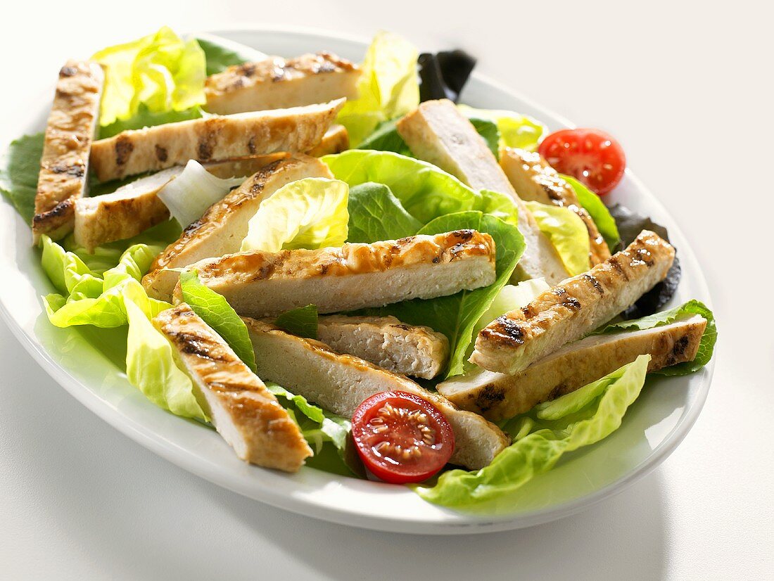 Salad with strips of chicken breast