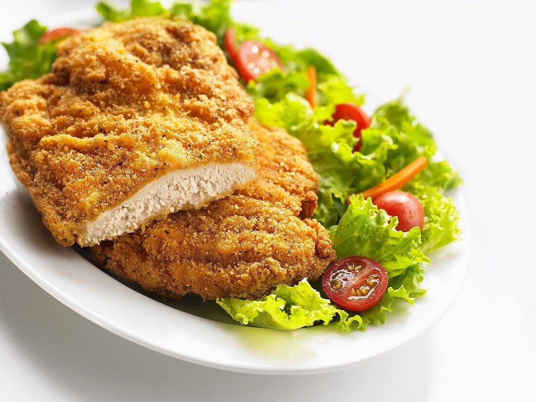 Breaded chicken breast with salad