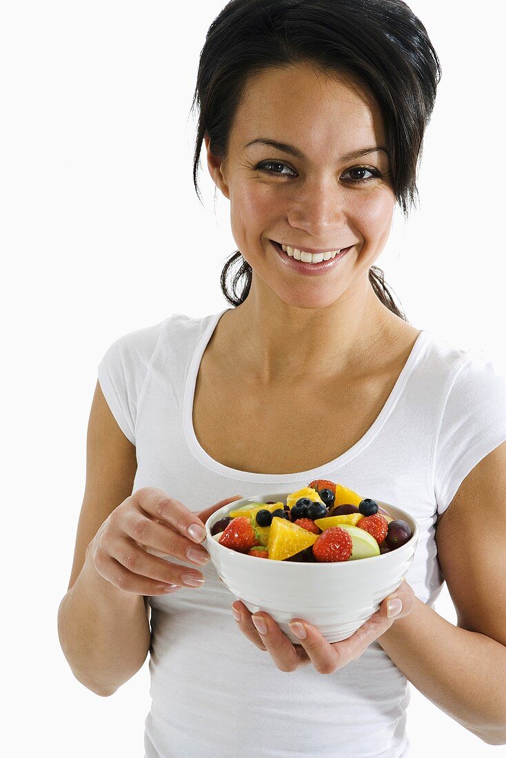 Woman holding fruit salad