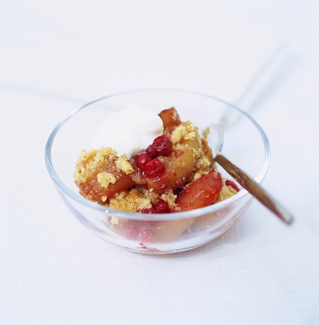Apple and raspberry crumble with cream