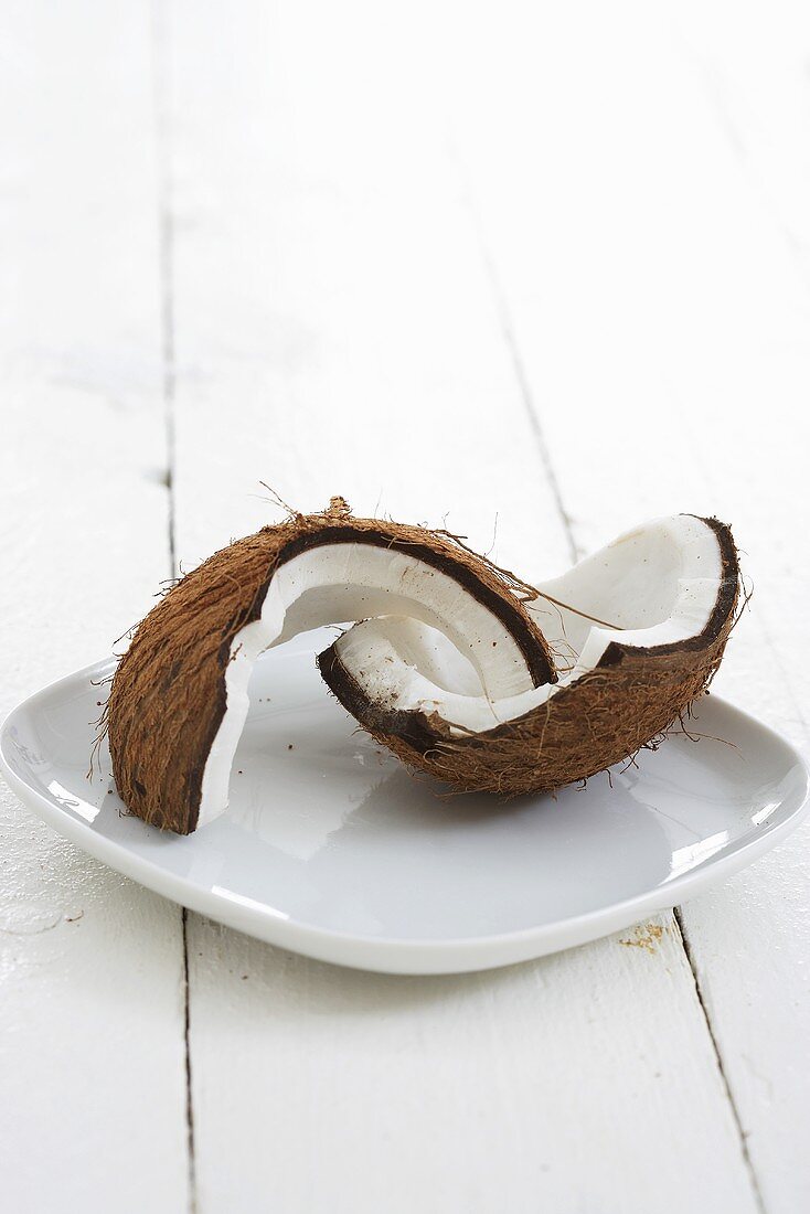 Broken coconut on plate