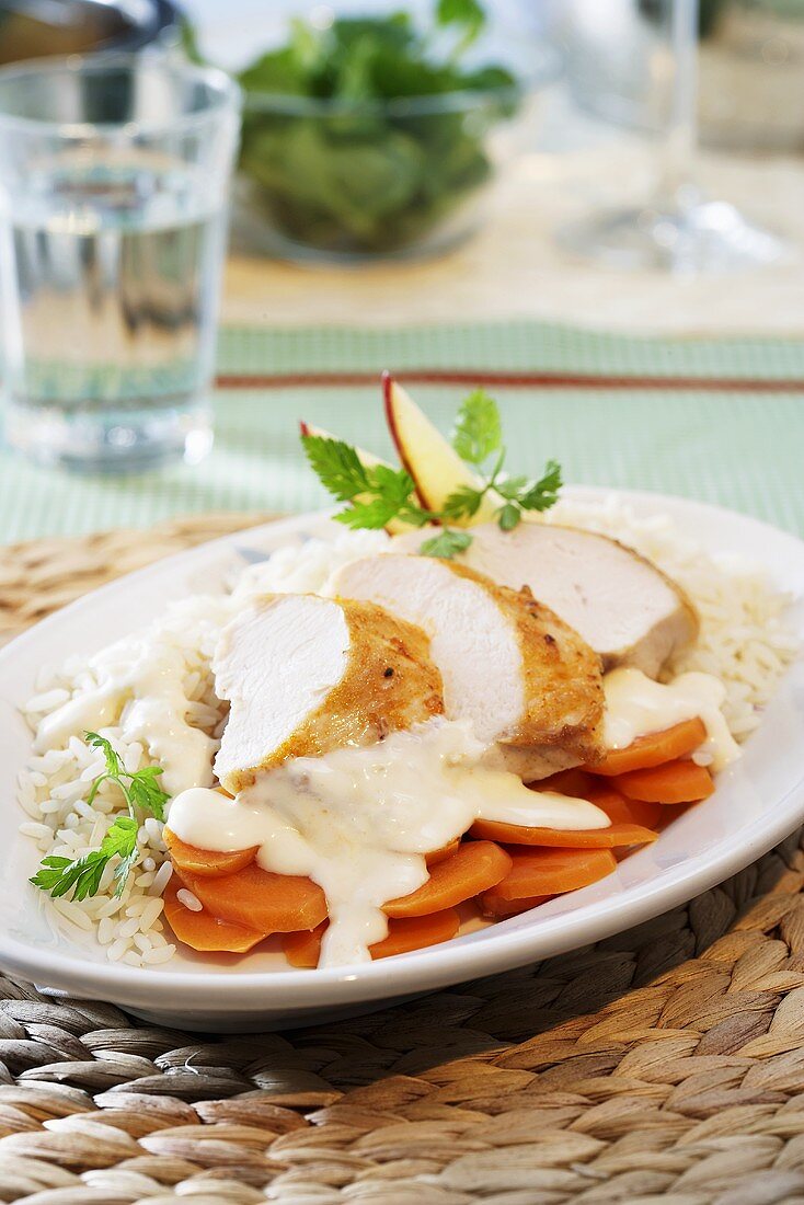 Chicken breast with Calvados, carrots and rice