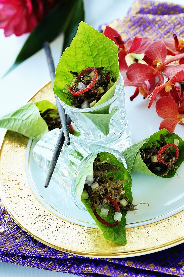 Shallots, ginger and coriander in betel leaves