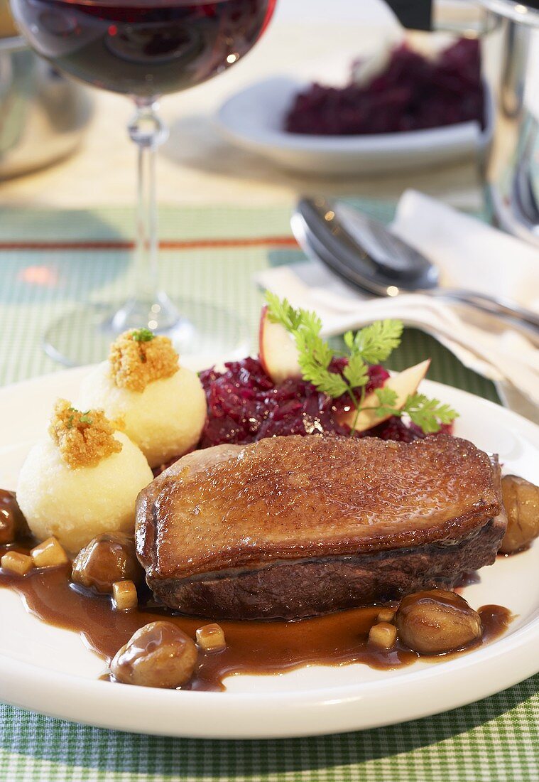 Duck breast with chestnuts, potato dumplings and red cabbage