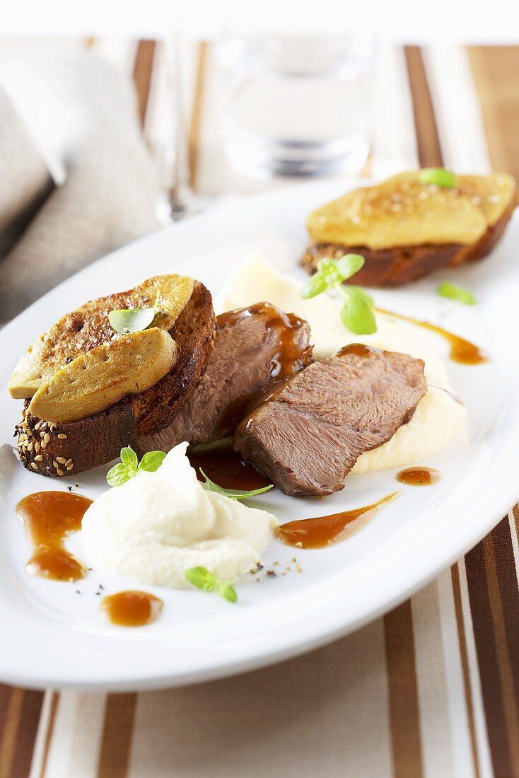 Roast beef with goose liver on baguette