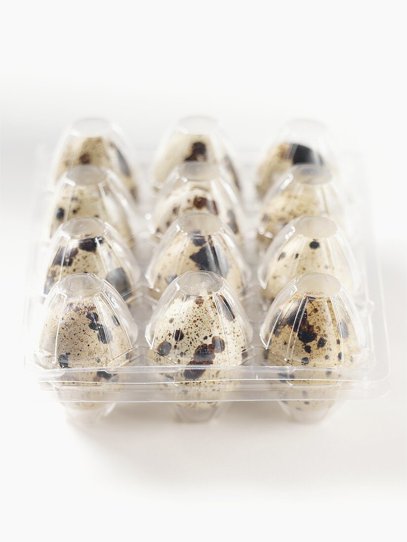 Quails' eggs in a plastic box