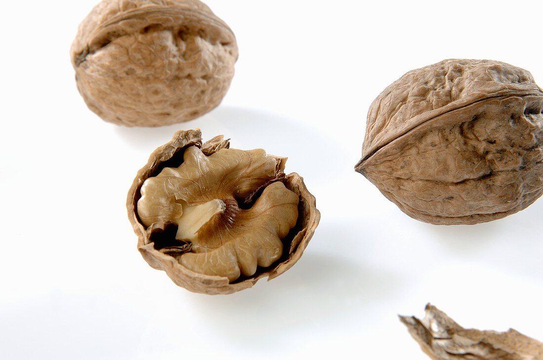 Whole walnuts and half a walnut