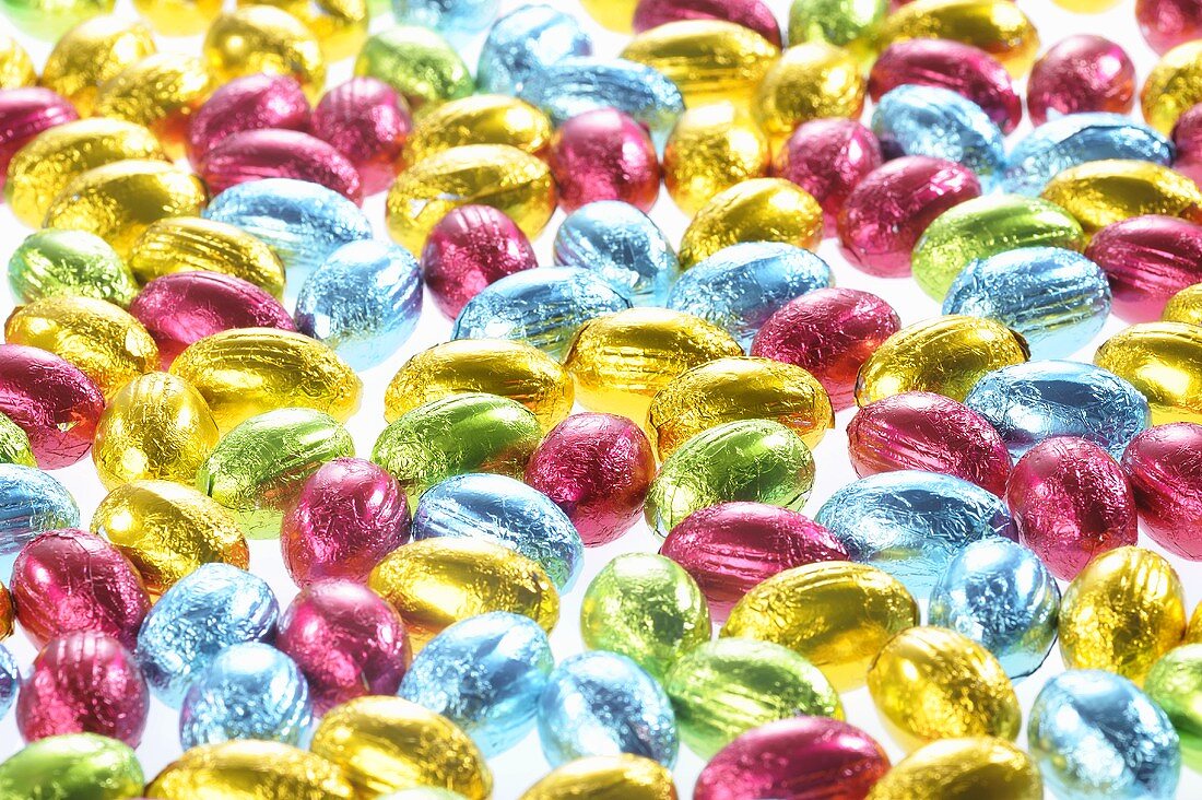 Small chocolate eggs in coloured foil
