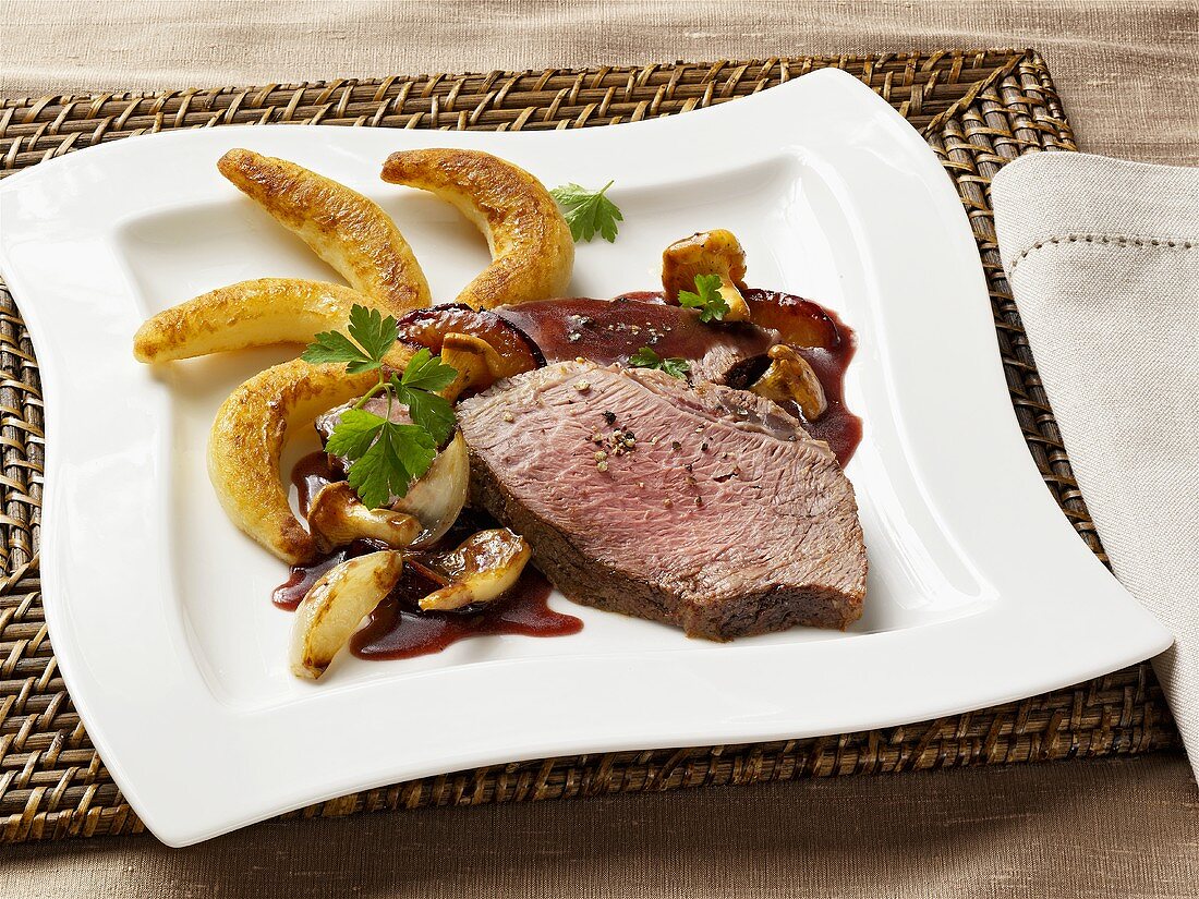 Beef with plum sauce and chanterelles