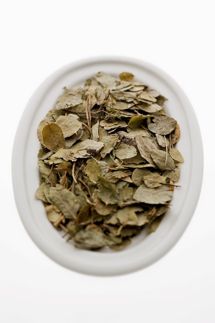 Dried blueberry leaves in bowl from above