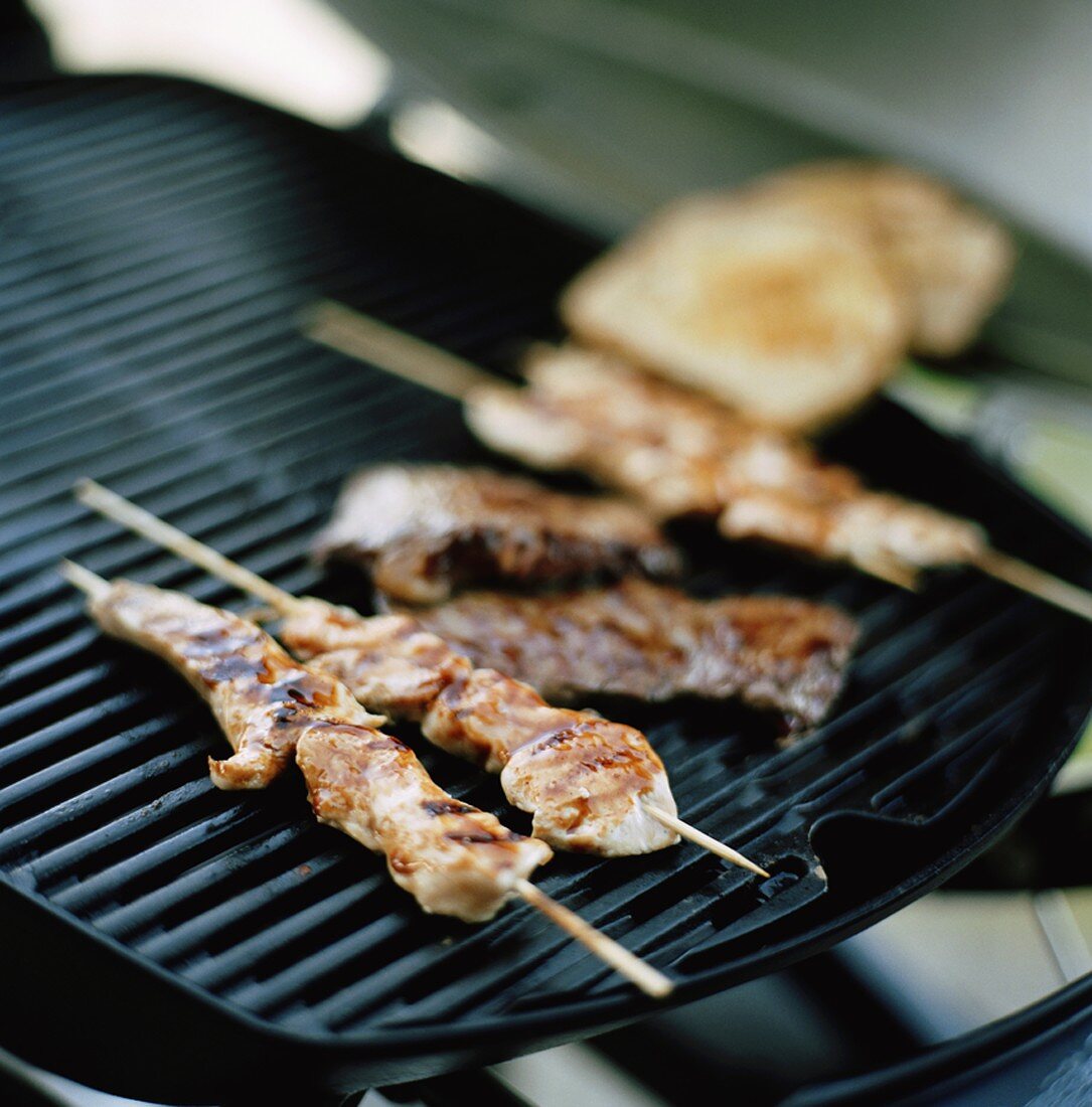 Satay on a barbecue