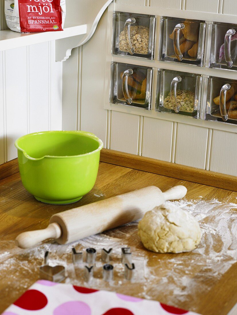 Biscuit dough and cutters in kitchen