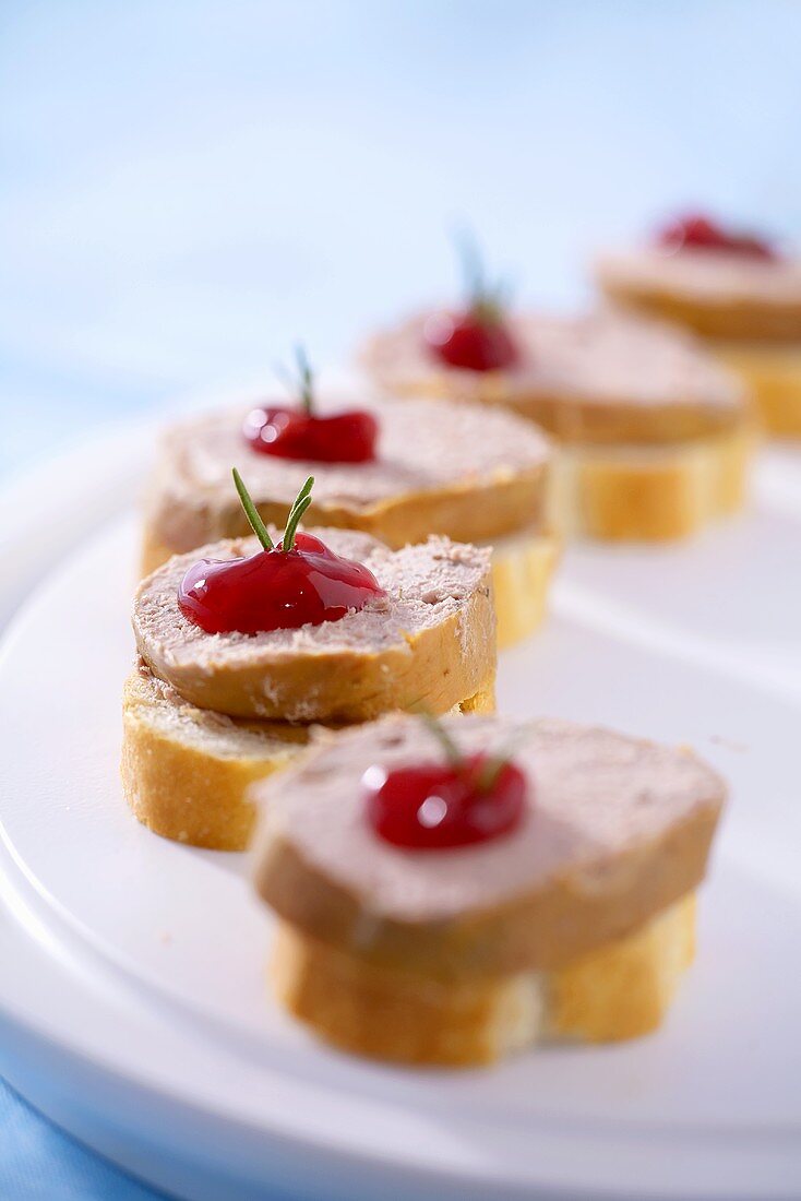 Canapés: pâté, cranberry jelly & rosemary on baguette slices