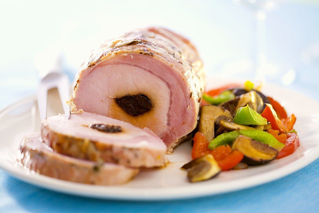 Ham stuffed with prunes, vegetable salad