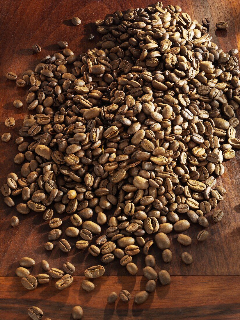 Coffee beans on wooden background