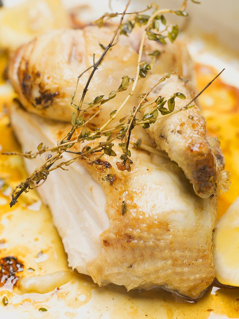 Half a roast chicken with thyme