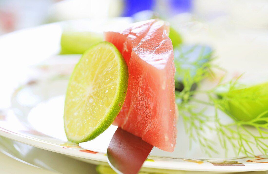 Piece of raw tuna with lime