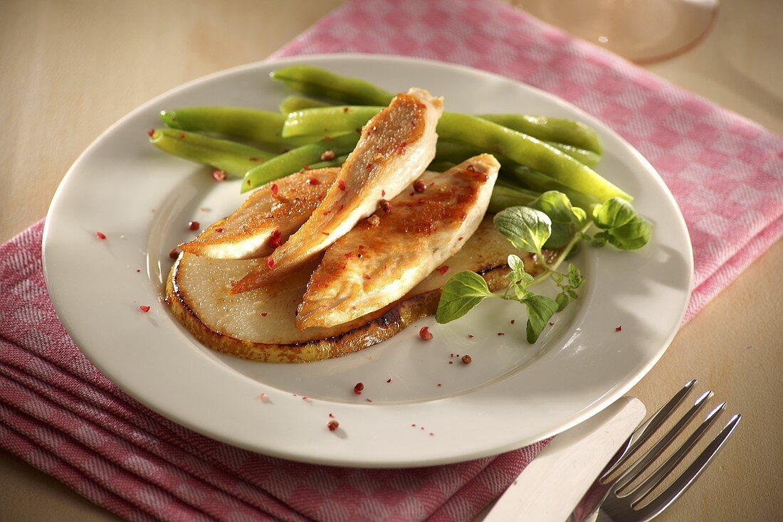 Chicken breast on slice of potato with green beans