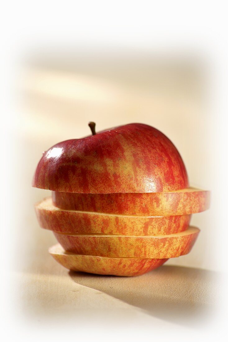 Apple slices, stacked to form an apple