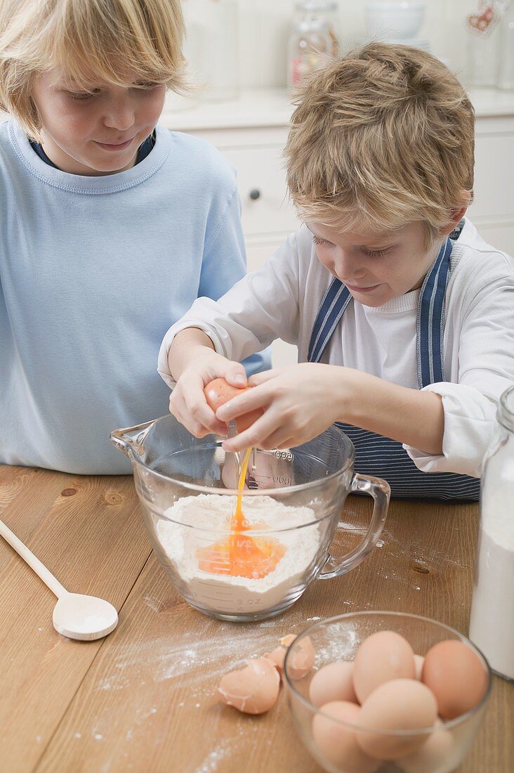 Two boys baking