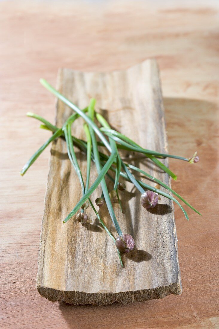 Chives on piece of wood
