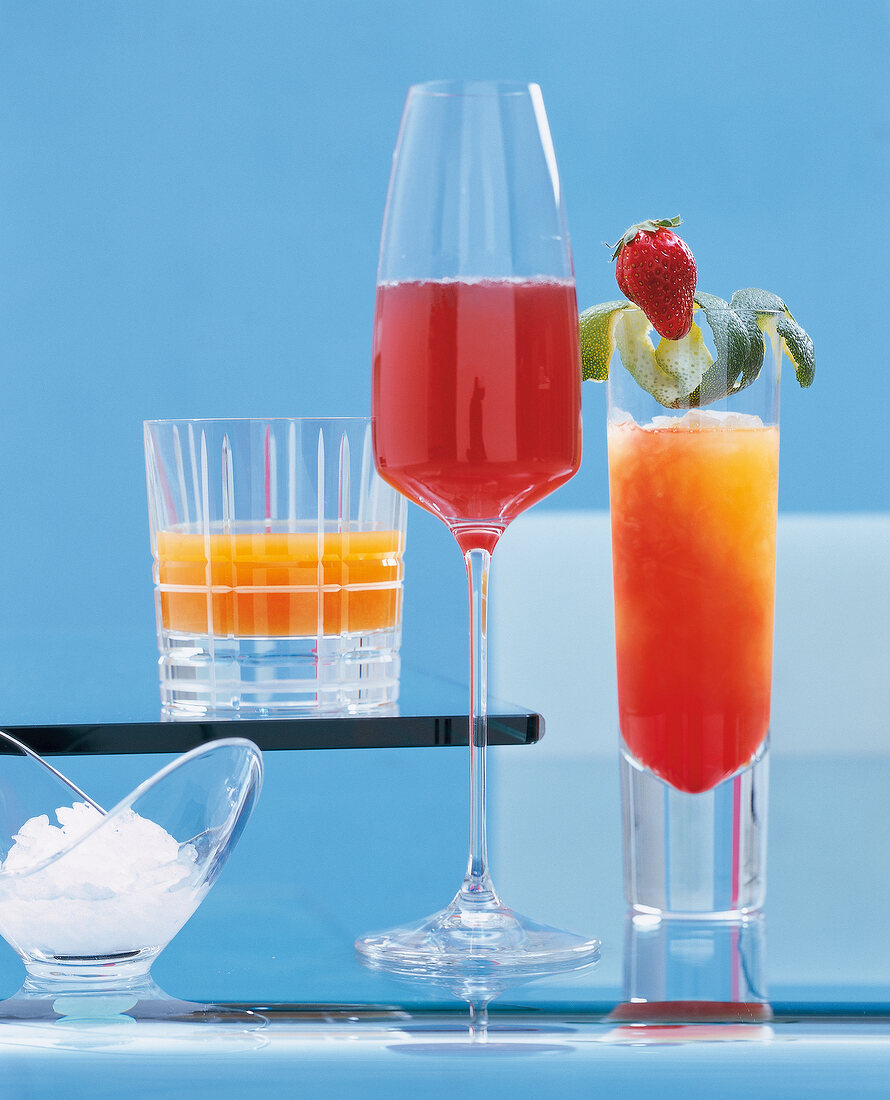Sherry sour peach cava and other cocktails against blue background