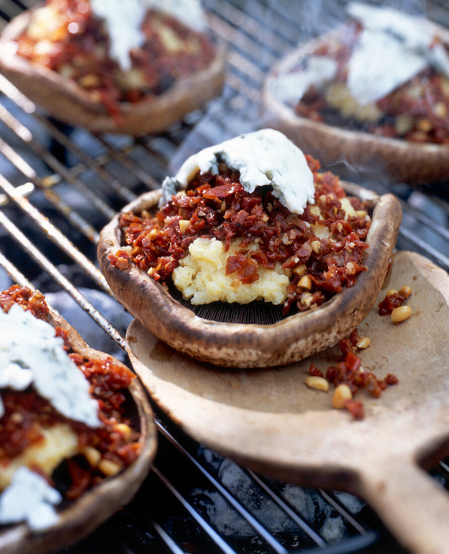 Close-up of stuffed mushrooms on grill for barbecue