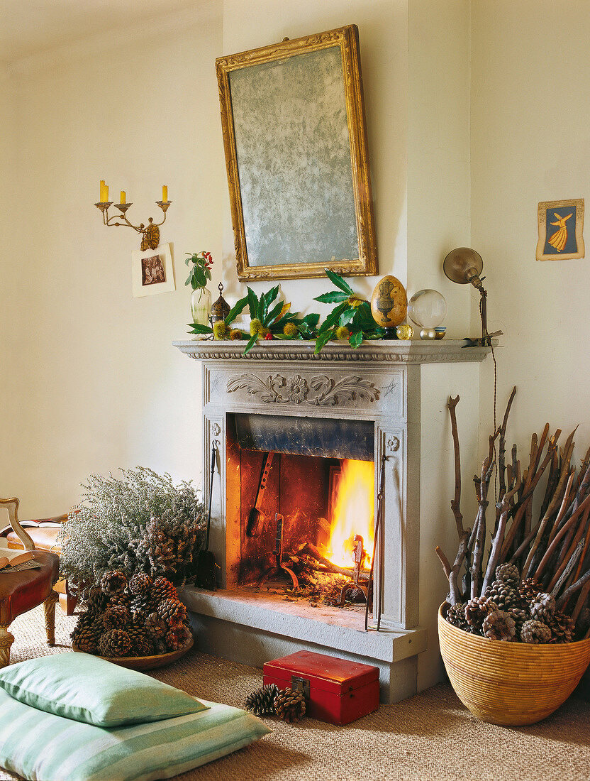 Burning fireplace in living room decorated for Christmas