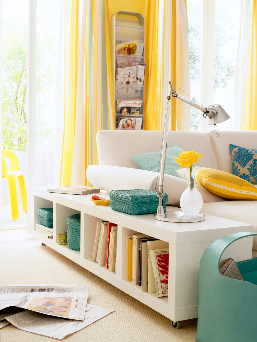 White wooden shelf with wheels in living room