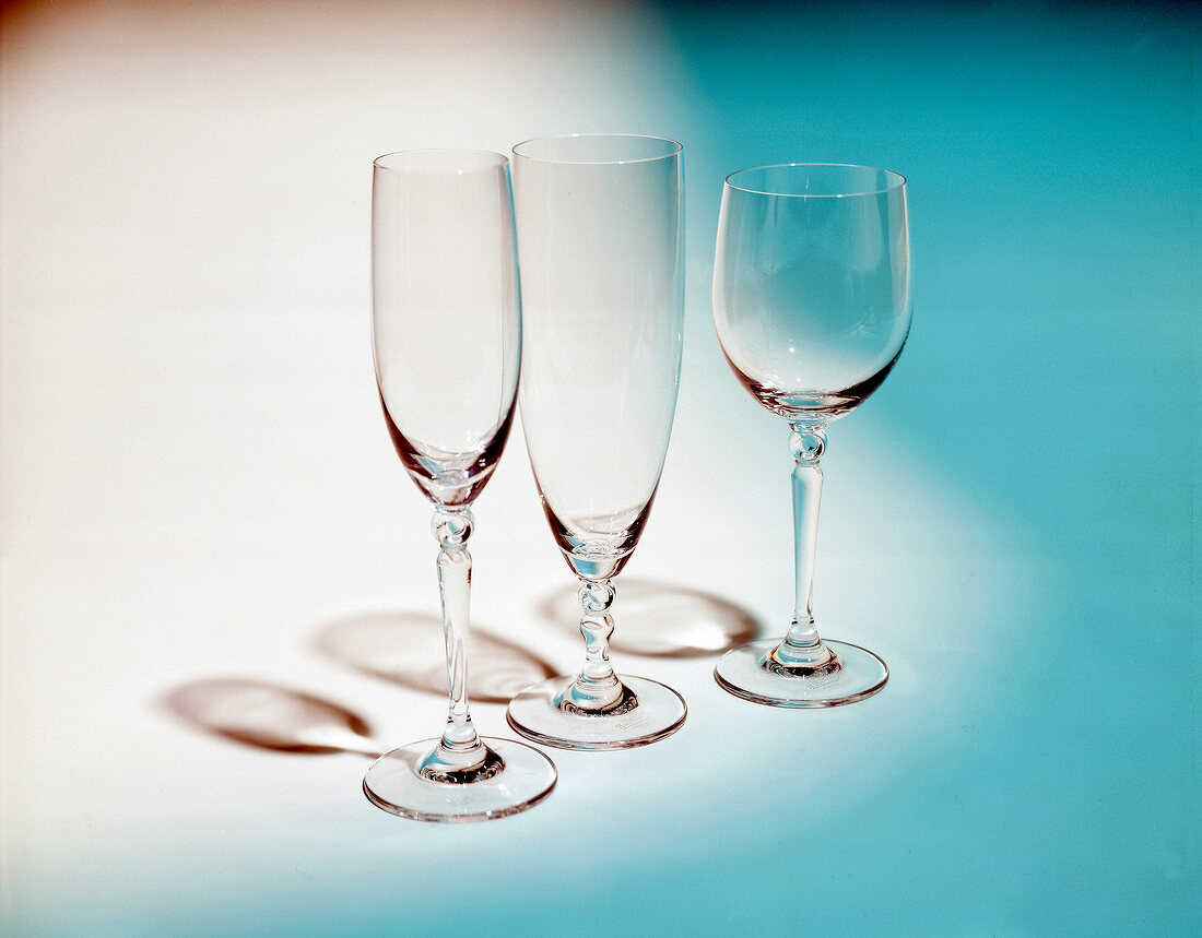 Three different goblets on blue-white background
