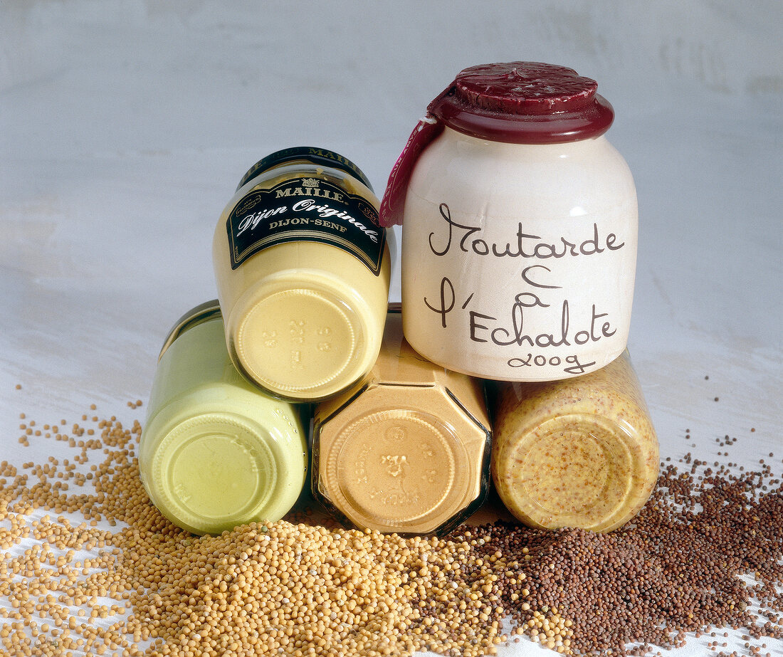 Different types of french mustards in jars