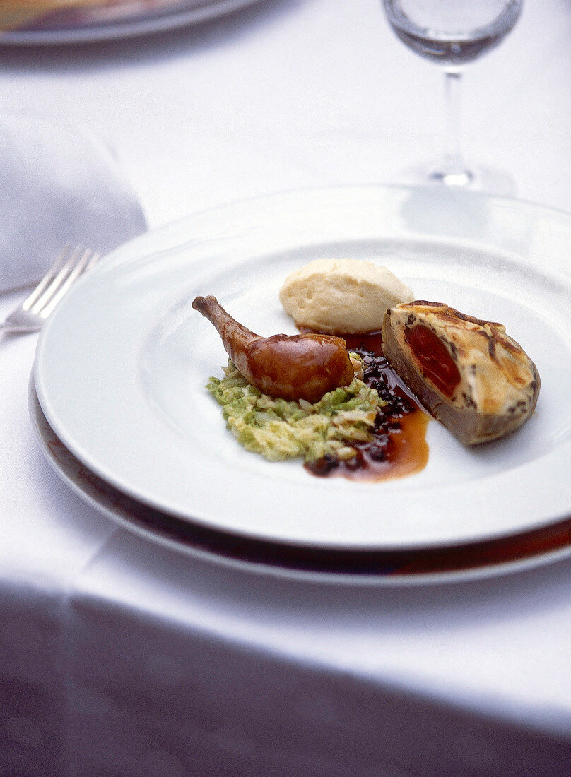 Bresse pigeon breast on artichoke on plate