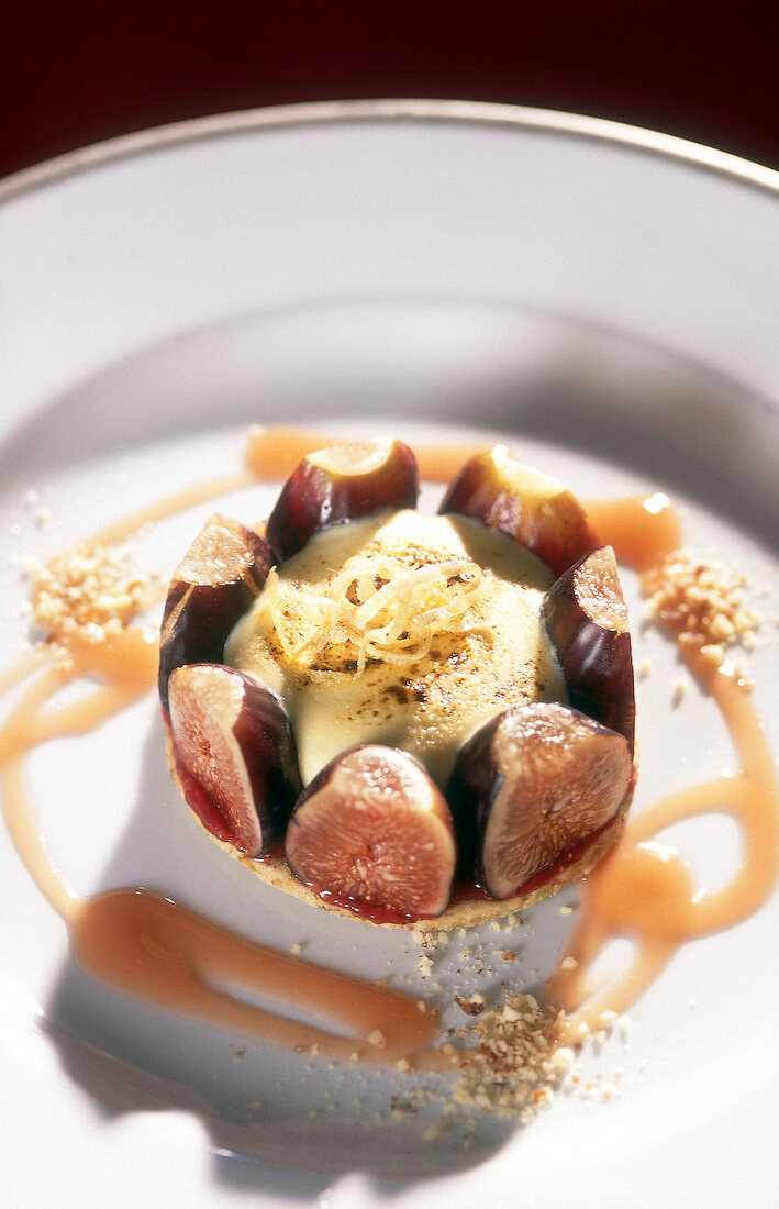 Close-up of fig tart with bourbon sabayon on plate