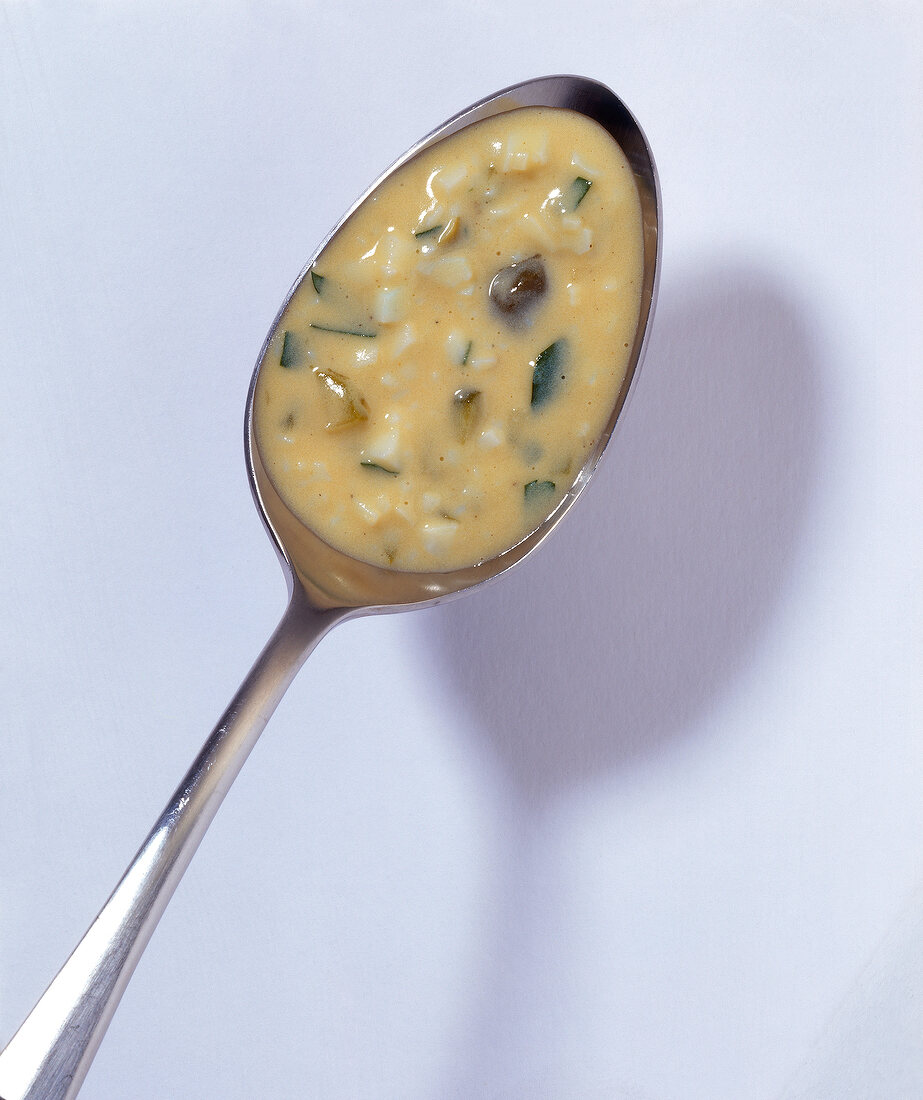 Close-up of spoon with gribiche sauce