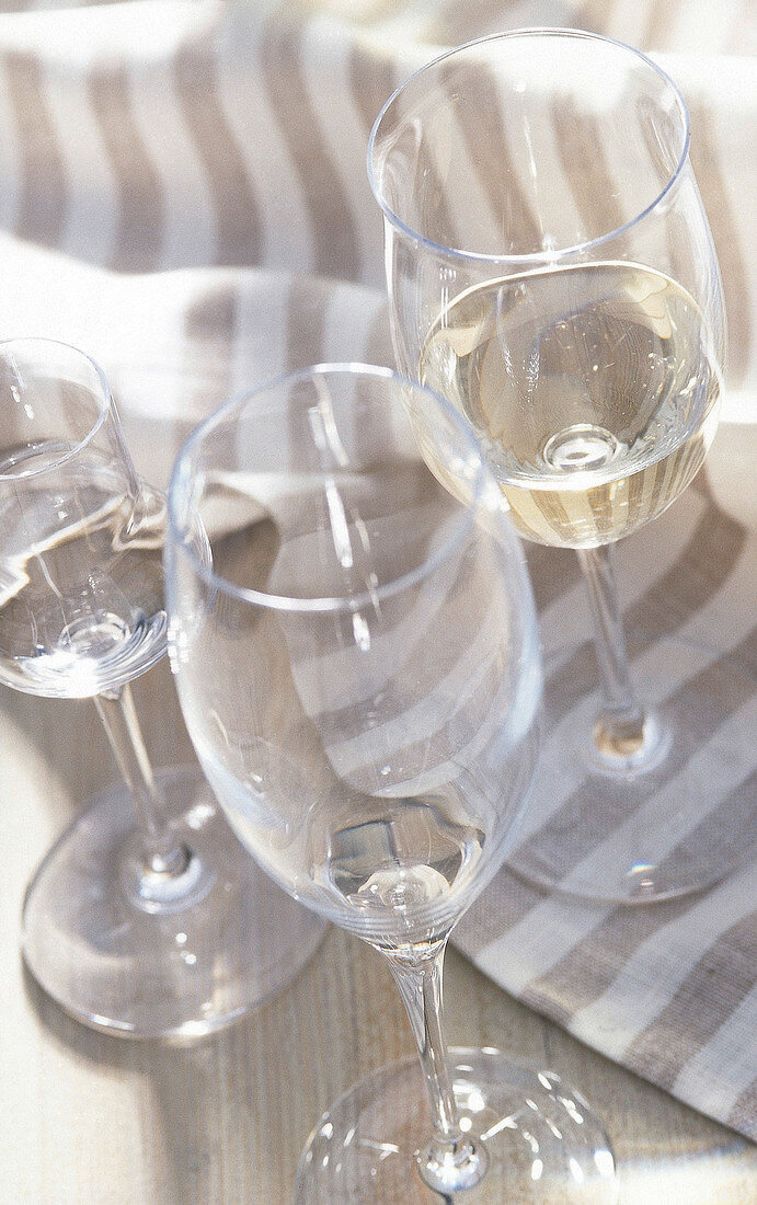 Close-up of champagne, riesling and shot glasses
