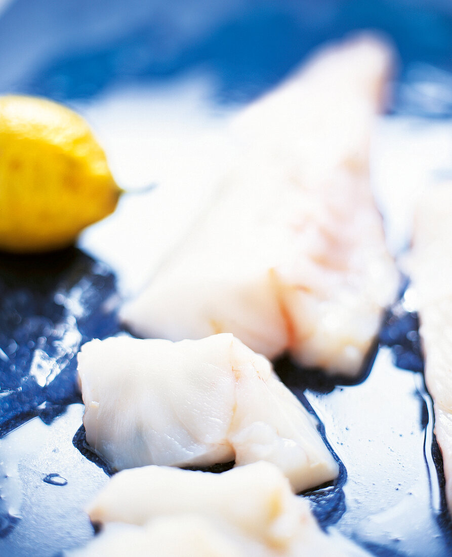 Close-up of monkfish fillets being prepared