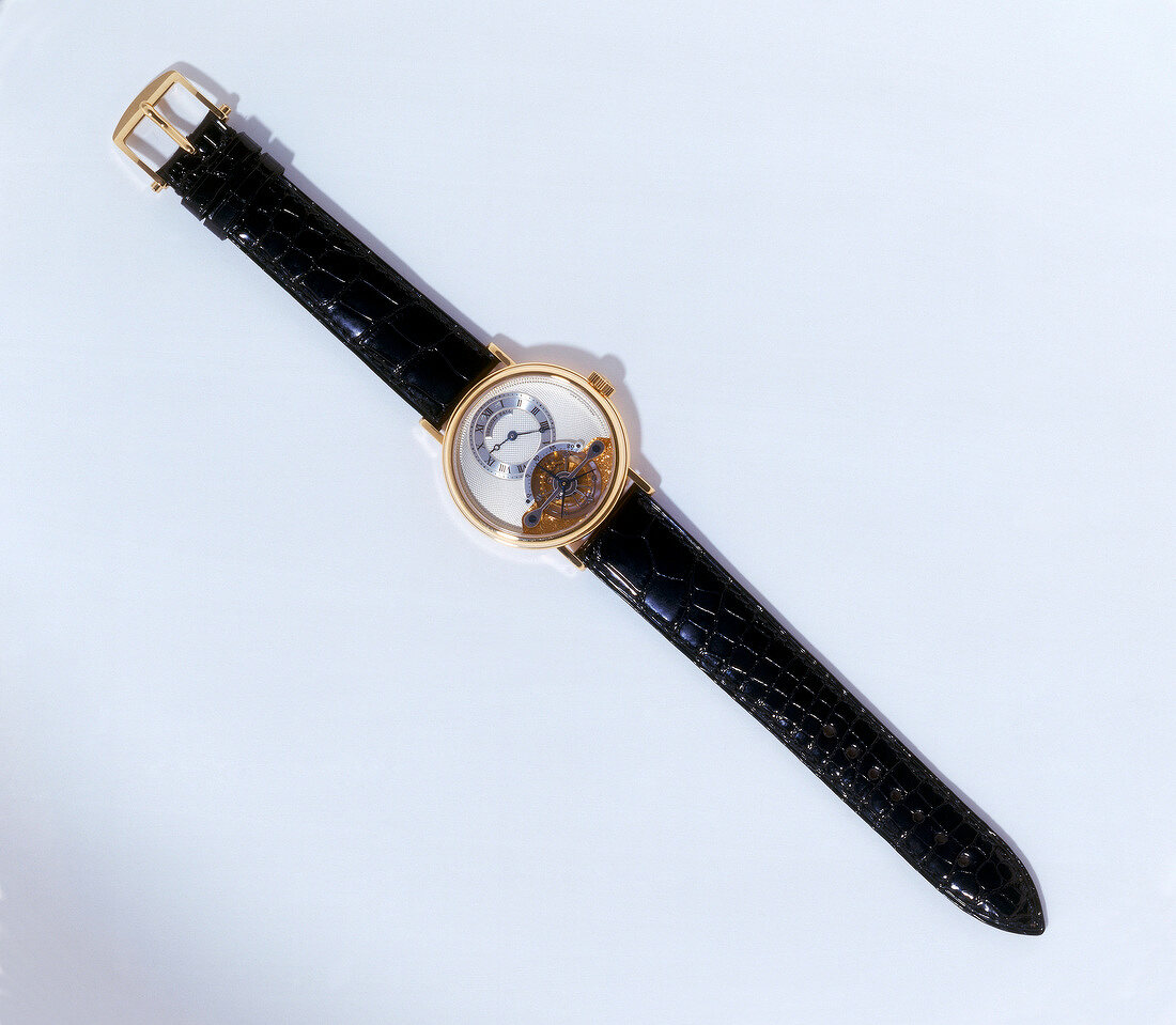 Close-up of wrist watch on white background