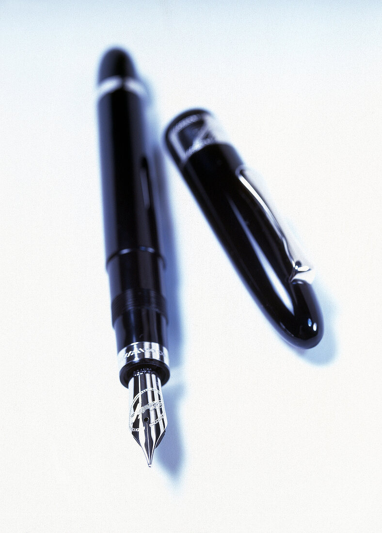 Close-up of elegant fountain pen on white background