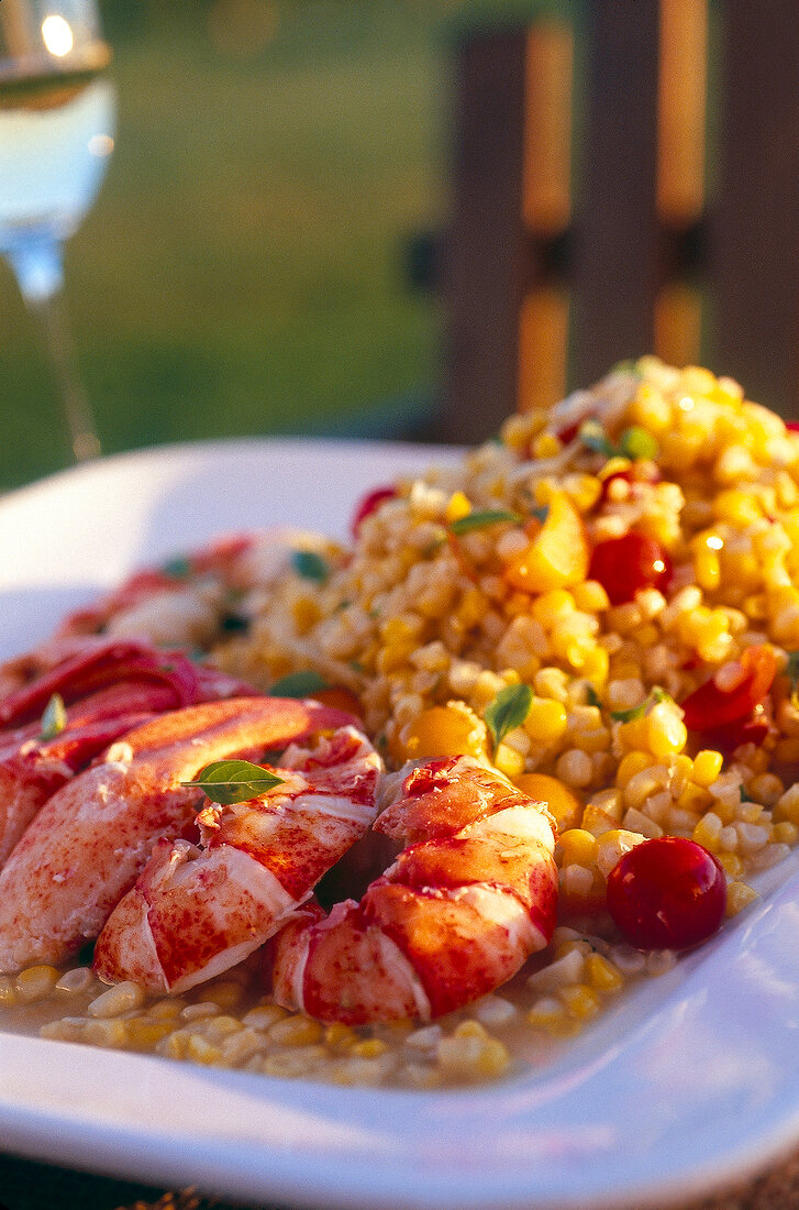 Close-up of lobster with corn in serving dish