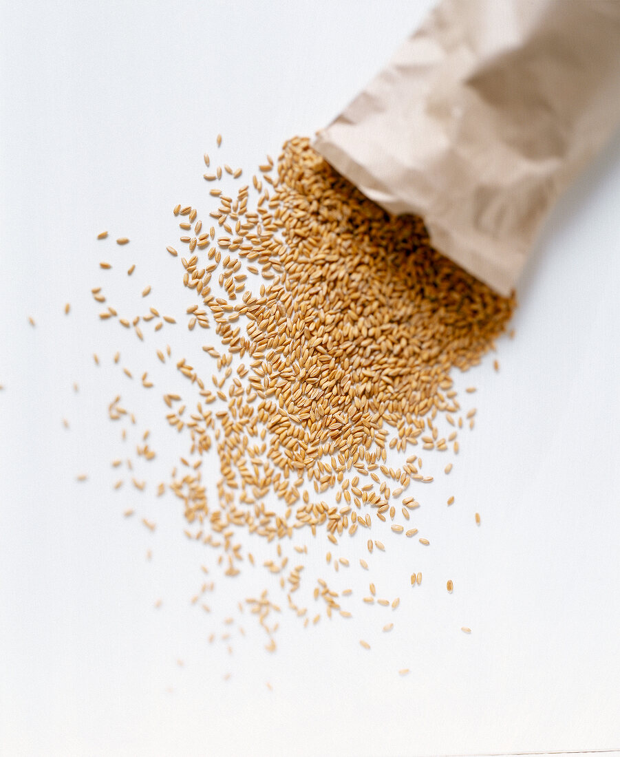 Oats spilling from brown bag