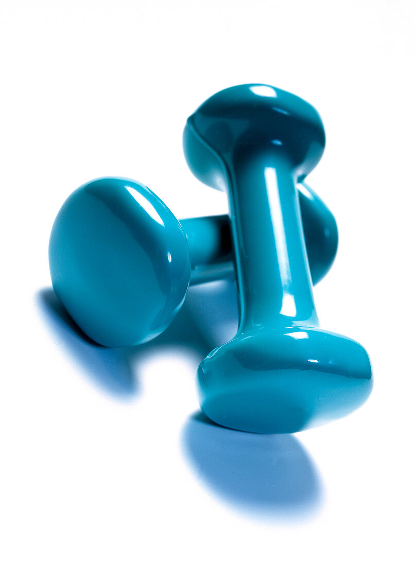 Close-up of blue dumbbells on white background