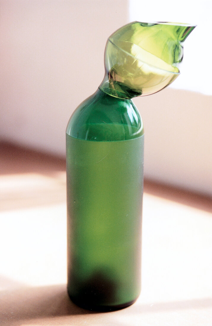 Close-up of green vase on floor