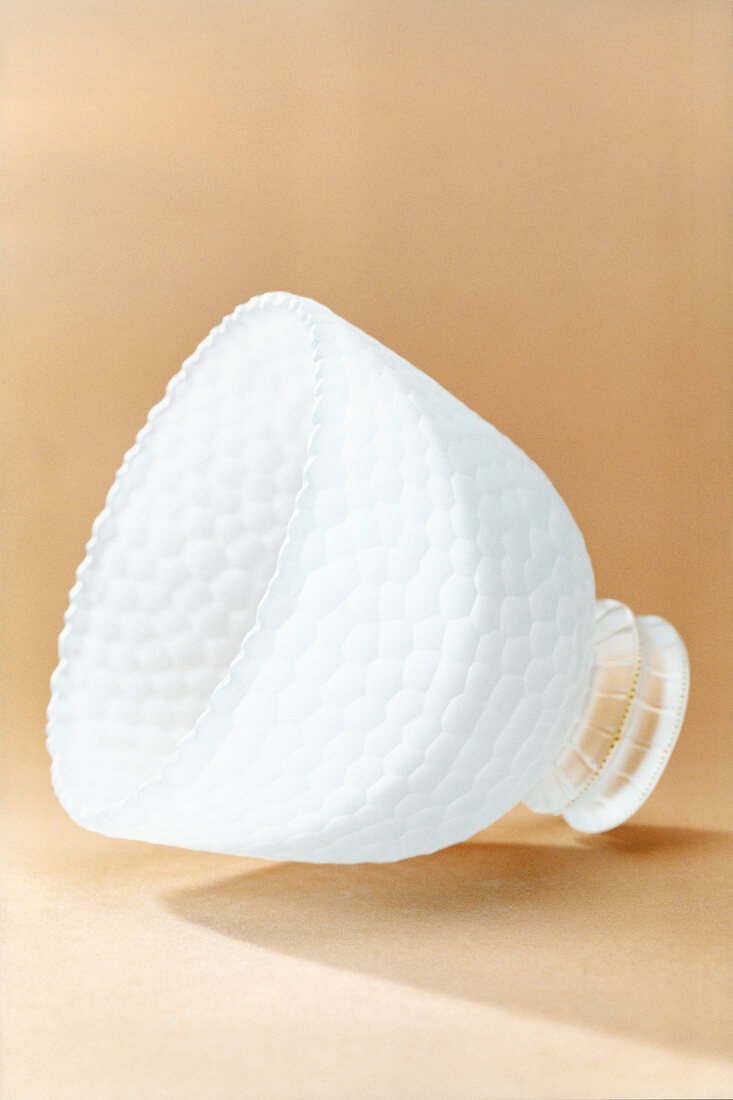 Close-up of white glass cup