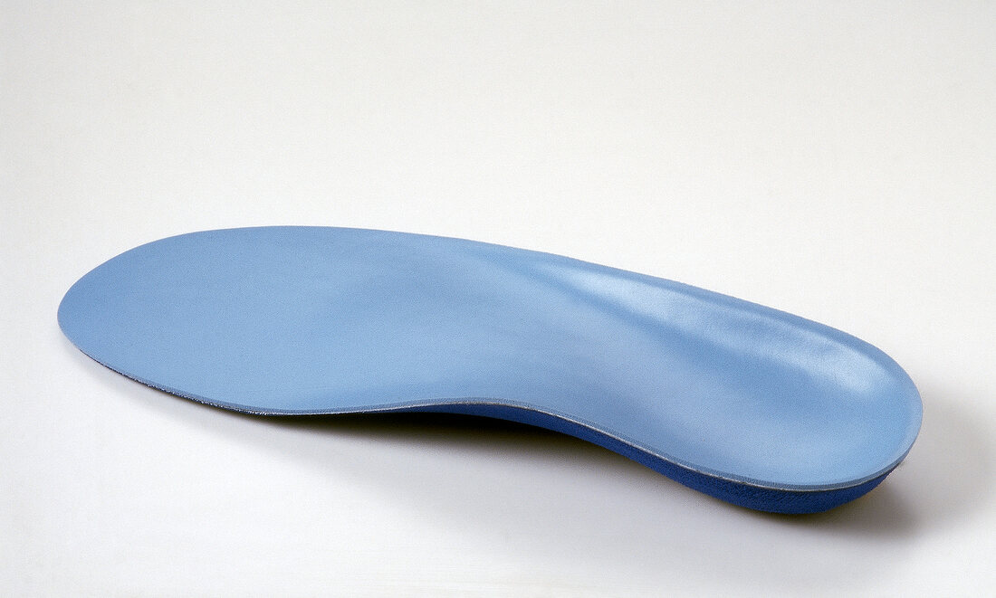 Close-up of insole of running shoes on white background