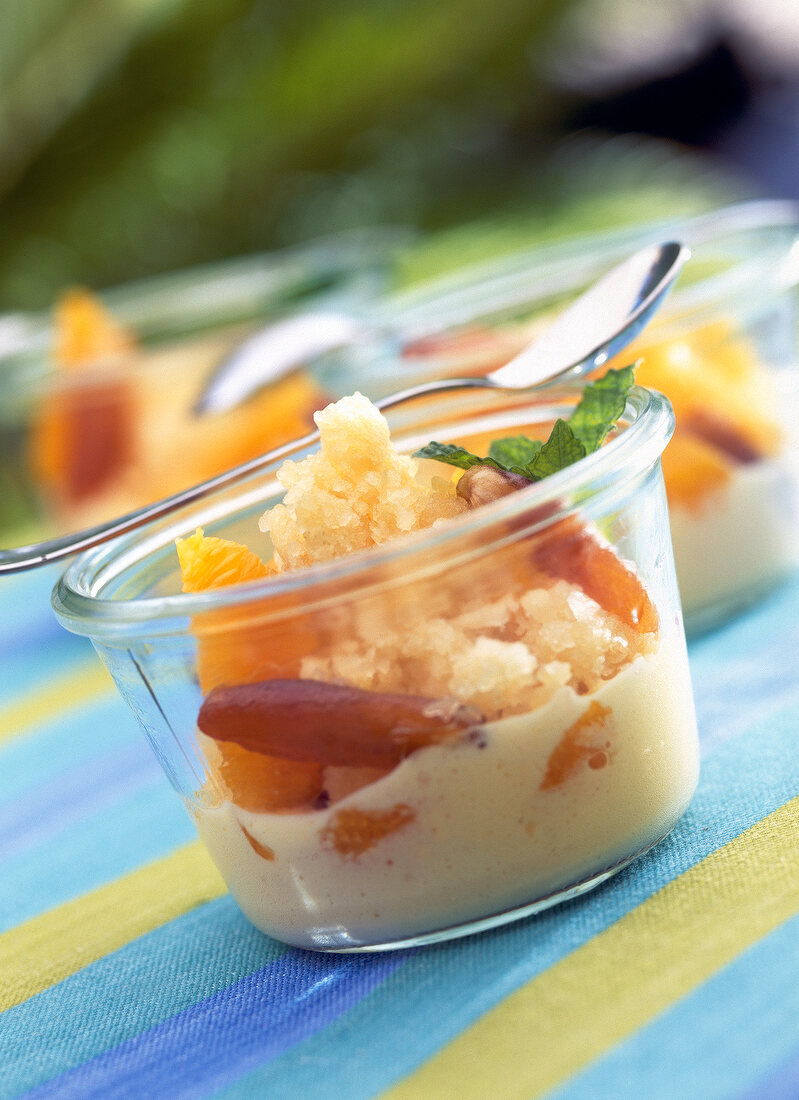 Granita of green tea with sabayon orange and dates in glass bowl