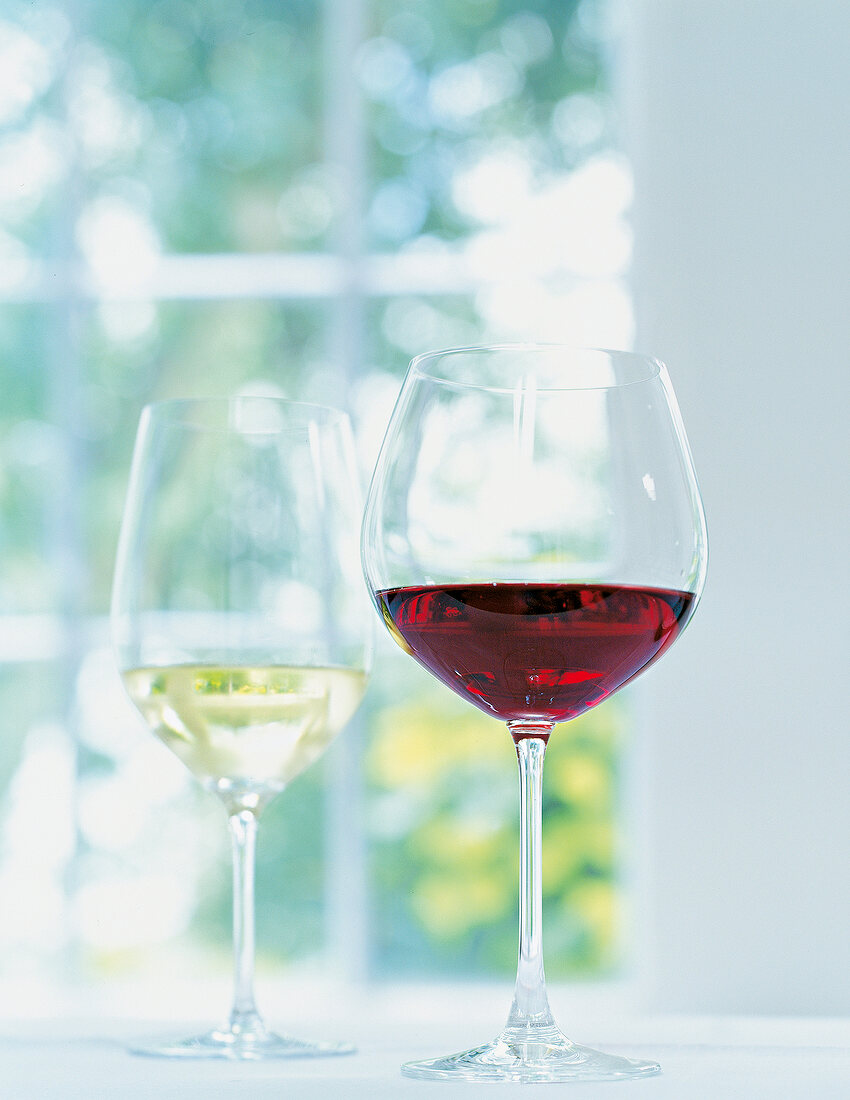 Two wine glasses with red and white wine